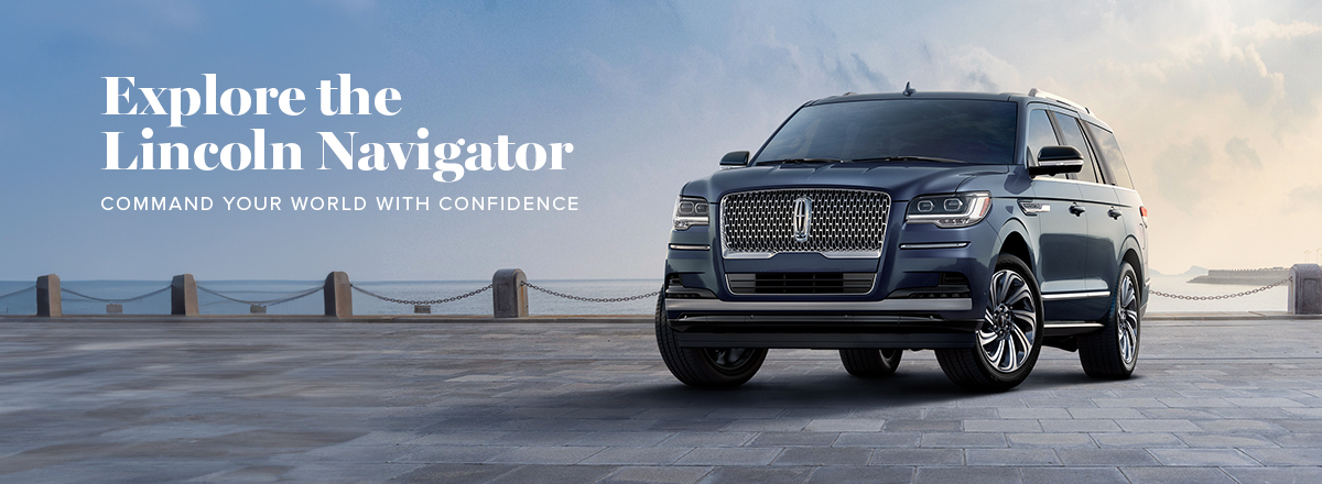 A Lincoln Navigator in Ocean Drive Blue Metallic is parked by a pier.
