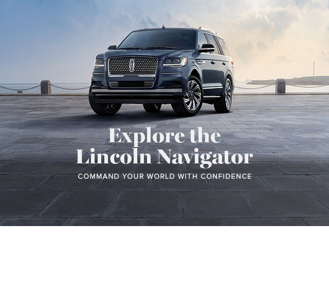 A Lincoln Navigator in Ocean Drive Blue Metallic is parked by a pier.